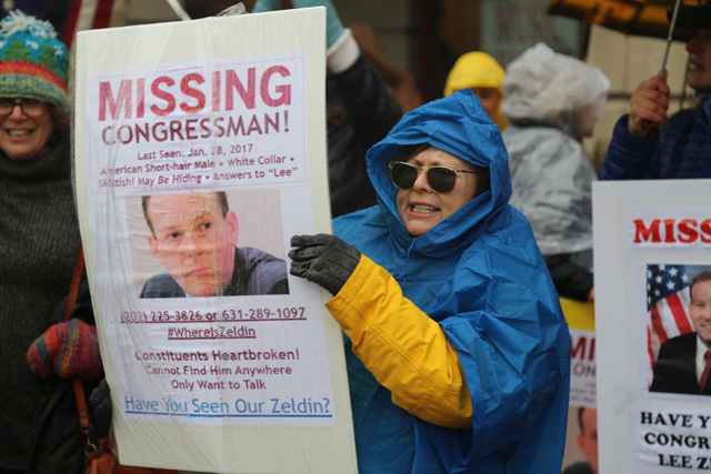 Demonstrators accused the congressman of being 'missing' Tuesday. (Credit: Grant Parpan)