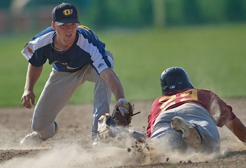 GARRET MEADE PHOTO | North Fork shortstop Eric Solberg tagging out Riverhead’s Josh Mason in a game last summer. 