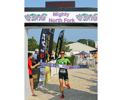 Billy Holl of Bayport, in only his second year in the sport, won the 17th annual Mighty North Fork Sprint Triathlon on Sunday morning at Cedar Beach in Southold. (Credit: Daniel De Mato)