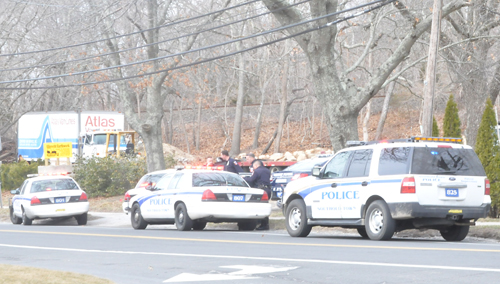 Southold Town police investigate a scene on Main Road in Laurel Friday morning. (Credit: Michael White)