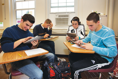 KATHARINE SCHROEDER PHOTO | Students in Ms. Salmaggi's class work with iPads Tuesday morning at Southold High School.