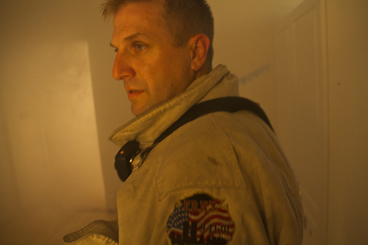 Assistant Fire Chief Bill Brewer stands inside the smoke-filled house after training. (Credit: Paul Squire)