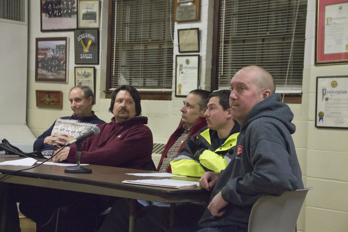 Greenport Fire Chief Harry Breese (right) addresses the Village Board at Wednesday night's meeting. (Credit: Paul Squire)