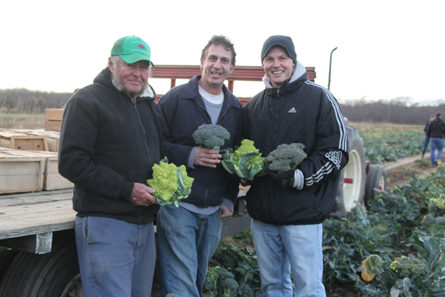 Farmer Gene Wesnofske (left) collaborated with his son, Jason (right), and James Stahl, both Southold High School teachers, on the community service project.