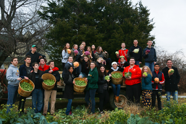 The Southold high school students pose for a photo with the produce they collected.