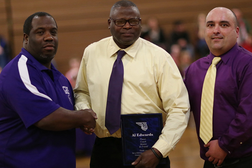 Al Edwards, center, was presented with a plaque during a pregame ceremony that included Greenport coach Ev Corwin, right, and assistant coach Rodney Shelby. (Credit: Garret Meade)