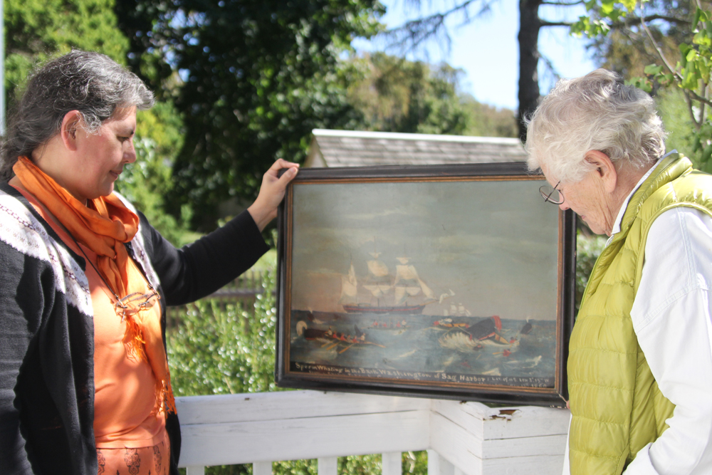Amy Folk (left) and Freddie Wachsberger with the Bark Washington painting