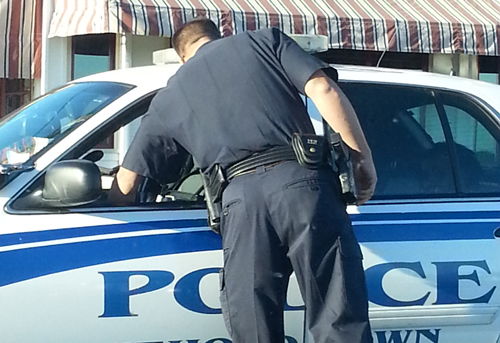 COURTESY PHOTO | Police respond to a call that a woman violated an order of protection in Greenport Sunday.