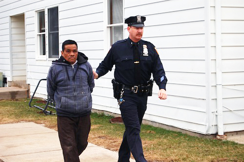 Arturo Fuentes-Chang is escorted into Southold Town Justice Court Thursday morning. (Credit: Cyndi Murray)