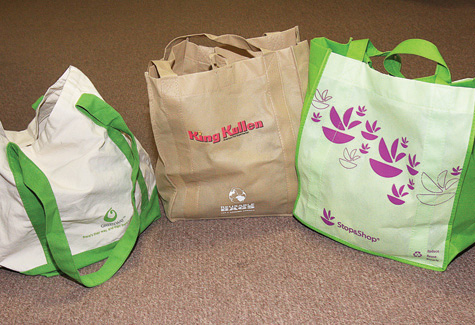Recyclable grocery bags such as these would largely replace plastic under any local ban. (Credit: Barbaraellen Koch, file)