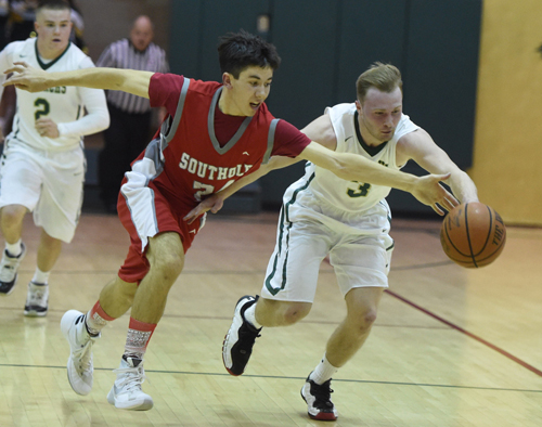 Southold's Pat McFarland and Bishop McGann-Mercy's Joe Jeskie chase after a loose ball during Thursday night's non-league game. (Credit: Robert O'Rourk)