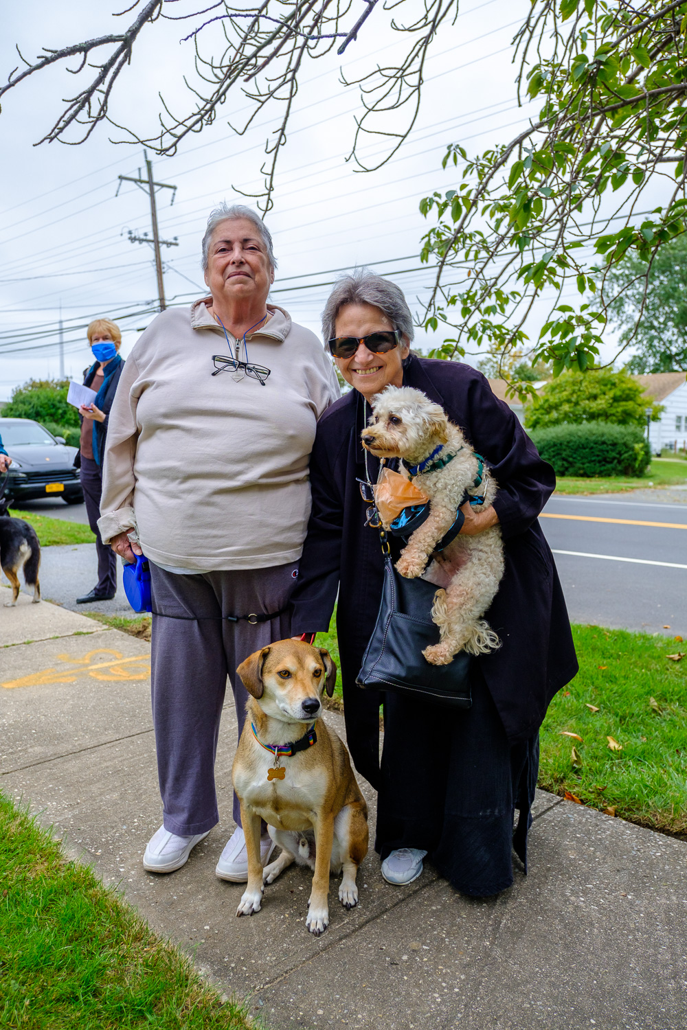 Jeannette Vera and Gi Eisen with Sammy, the retriever mix, and Paco. (Credit: Jeremy Garretson)