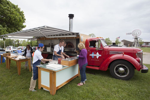 Rolling in Dough pizza truck serves pizza to the crowd. (Credit: Katharine Schroeder)