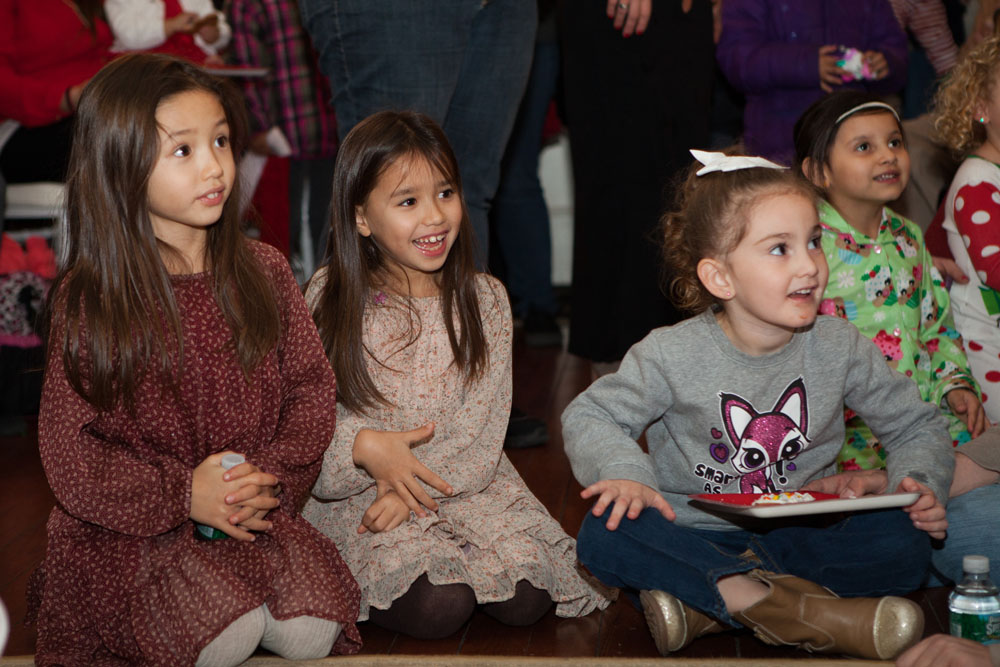A group of children wait for Santa's arrival at Brecknock Hall in Greenport. (Credit: Katharine Schroeder photos)