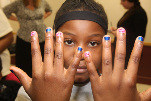 Zonura Williams, 9, picked a pink and blue colors with a zebra print design for her manicure.