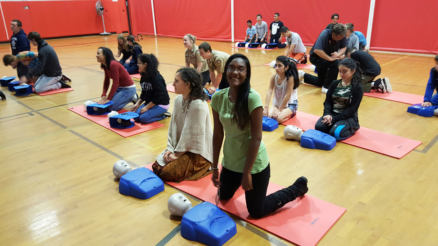 Southold students practicing hands-only CPR during gym class. (Credit: Chris Manfredi) 