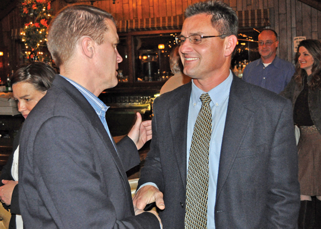 Town Supervisor Scott Russell, left, congratulates former councilman Chris Talbot at the Soundview Inn on Election Day 2009. The two will return to the Greenport restaurant May 21 for a nominating convention that will determine who will get the Republican nomination for supervisor this year. (Credit: Tim Kelly file)