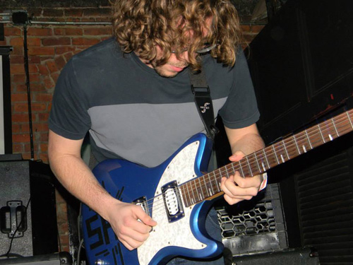 Chris Krasnow playing guitar. (Courtesy photo)