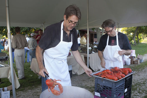Rob Buchanan of Greenport, left, and Chris Pickerell of Southold at the lobster station.