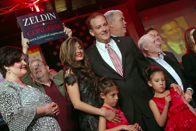 Congressman-elect Lee Zeldin celebrates his win with his wife and two daughters Tuesday night. (Credit: John Griffin)