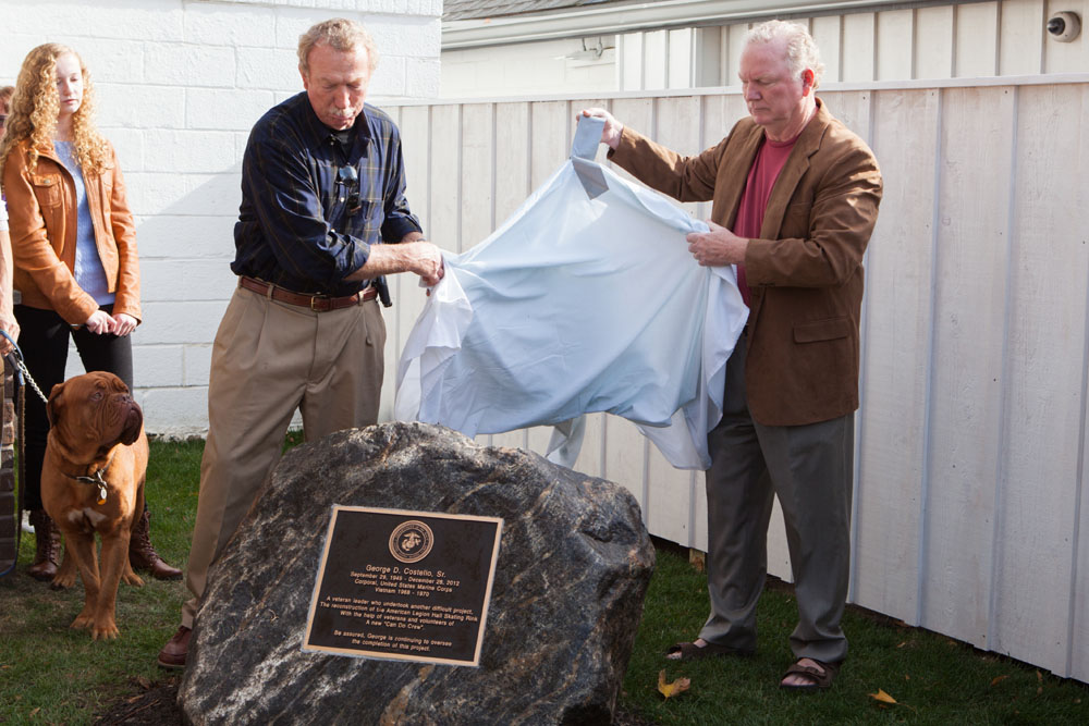 George's brothers John, left, and Tom Costello unveil the memorial plaque. (Credit: Katharine Schroeder)