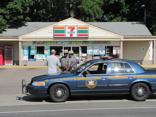 CYNDI MURRAY FILE PHOTO | Law enforcement officials outside Cutchogue 7-Eleven.