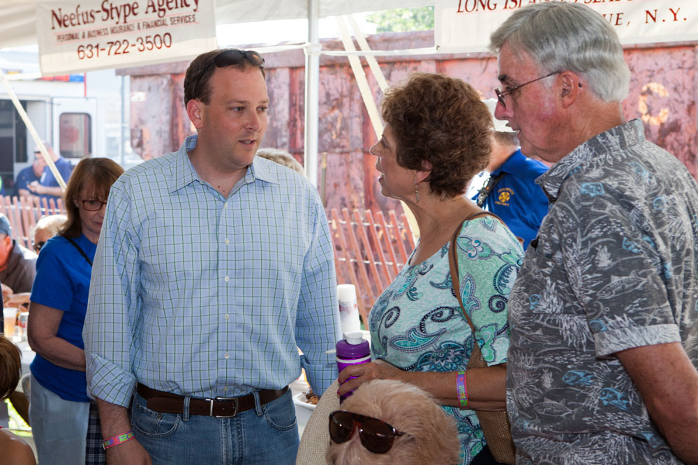 Congressman Lee Zeldin stopped by for a visit. He is shown here talking to Doris and Ron McGreevy of Mattituck. (Credit: Katharine Schroeder)