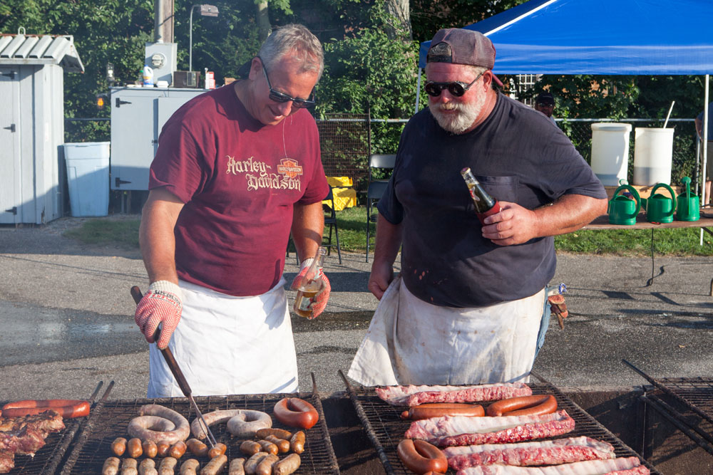 Dave Blados, left, and Tom Smith prepare a snack for the volunteers. (Credit: Katharine Schroeder)