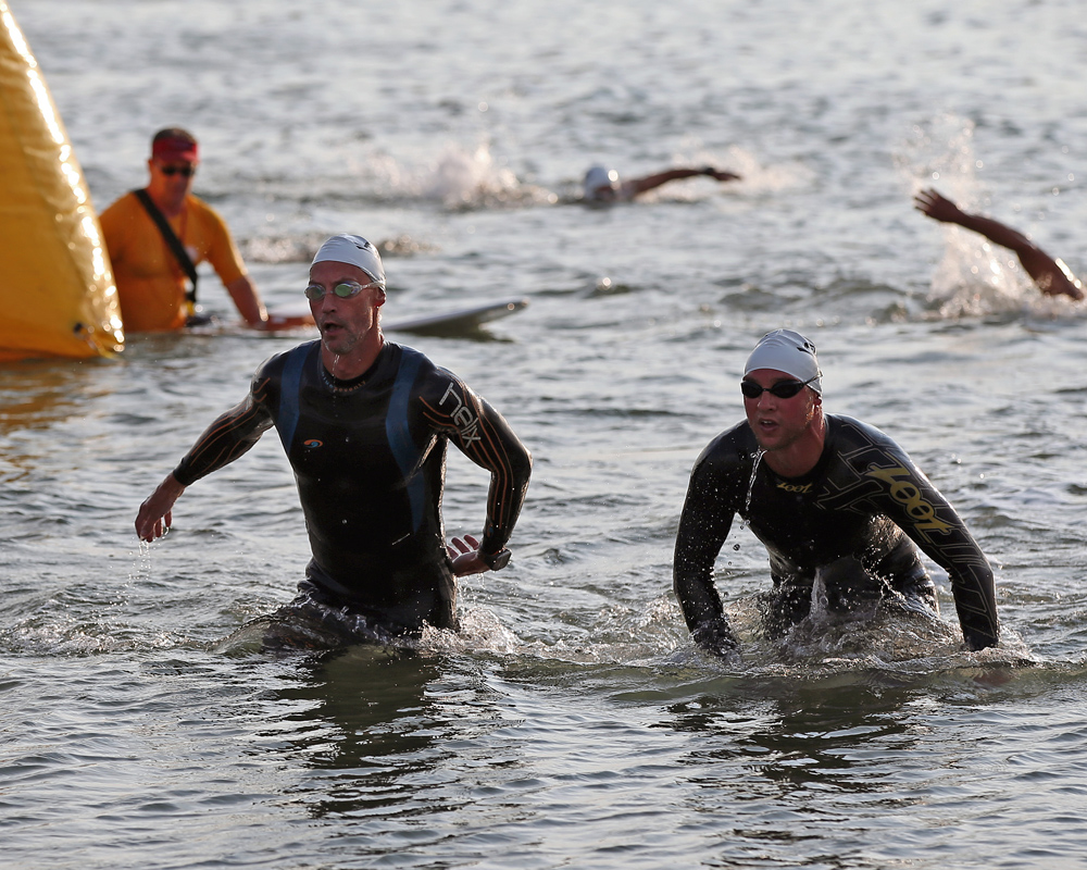 Adrian Mackay of NYC  (left) and Dominick Vulpis of East Rockaway (right) exit the water. Vulpis won the swim leg with a time of 4:47. (Credit: Daniel De Mato)