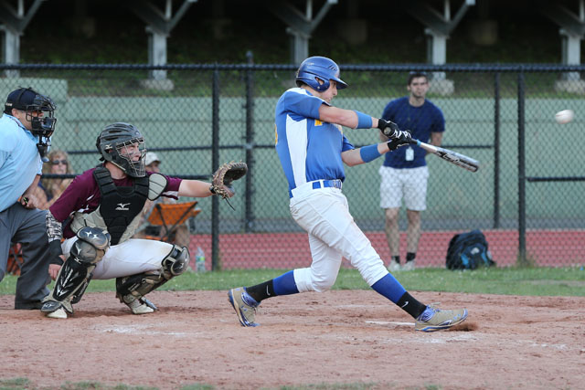 Chris Dwyer hits a double and drives in three runs in the 10th inning, putting Mattituck ahead 8-4. (Credit: Daniel De Mato)