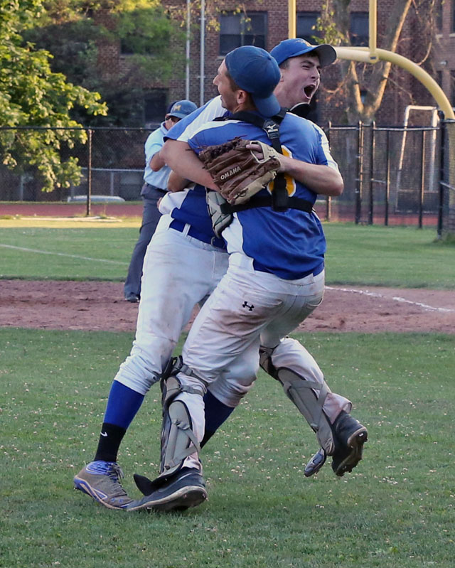 Chris Dwyer and Mike Onufrak celebrate after Mattituck defeated Albertus Magnus 9-5 in extra innings in the Class B Baseball South East Regional Championship game at Mamaroneck High School in Mamaroneck. (Credit: Daniel De Mato)