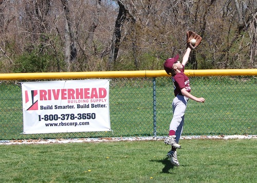 Brenden Buckley, 9, makes a catch. 