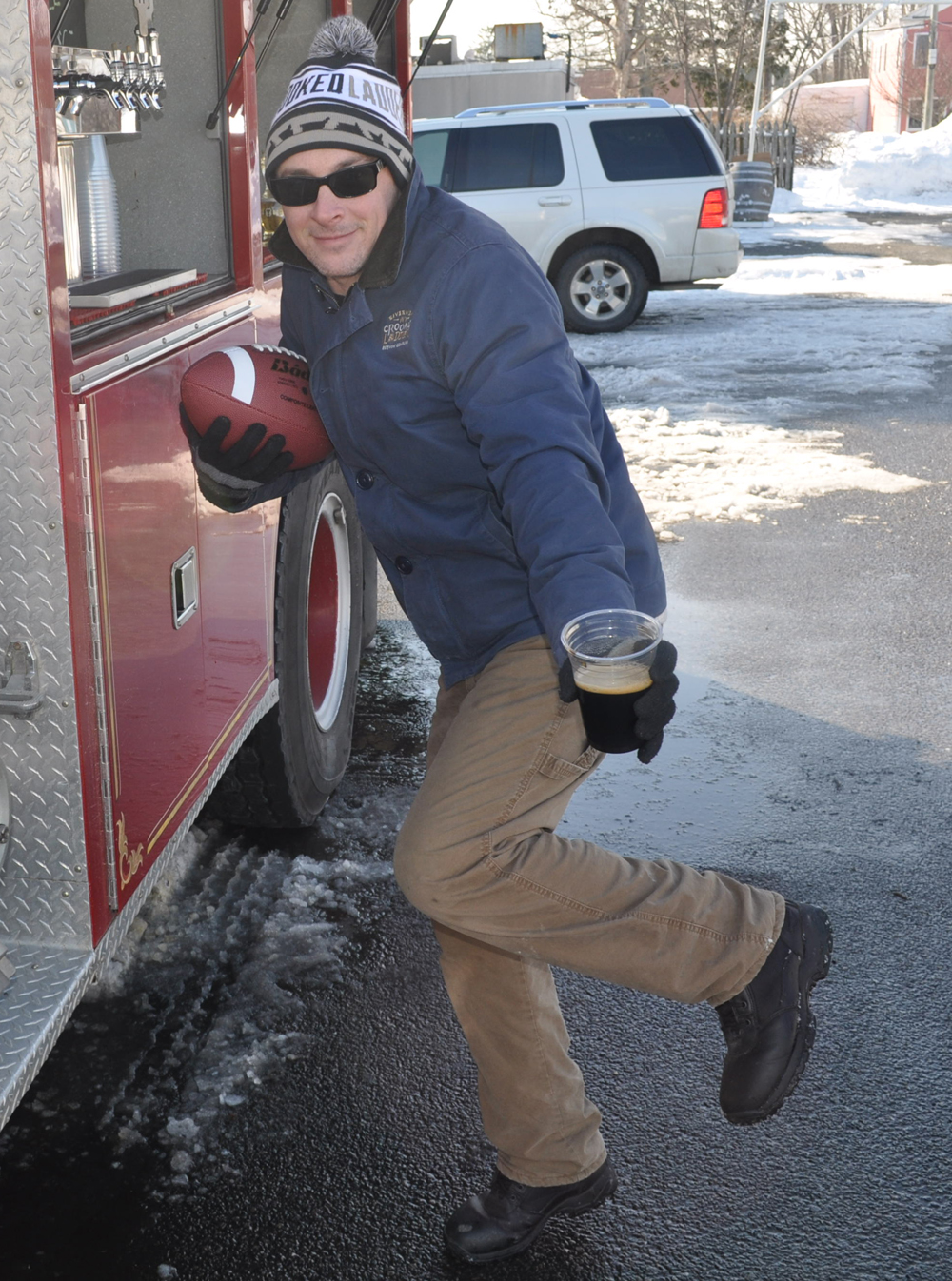 Nate Payne of Crooked Ladder Brewing Company strikes the Heisman pose ... or something like it.