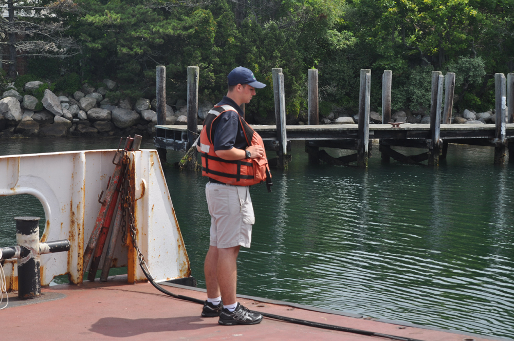 A Fishers Island ferry employee gets set for arrival to the island.