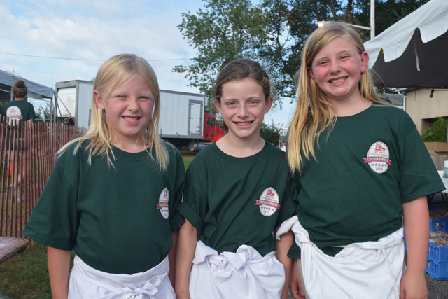 Reese Pearsall, 7, of Cutchogue, Jocelyn Kaelin, 9, of Southold and Emma Pearsall, 9, of Cutchogue all volunteered their time at Saturday's barbecue.