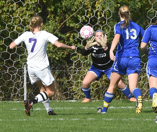 Mattituck goalkeeper Emma Fasolino makes a save on Port Jefferson forward Jillian Colucci, who leads the county in goals scored this year. (Credit: Robert O'Rourk)