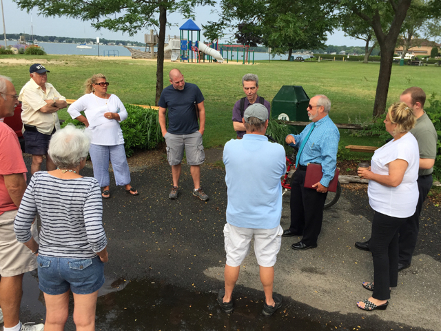 Greenport village administrator Paul Pallas, right, discusses drainage plans for Fifth Street Park with community members Monday. (Credit: Grant Parpan)