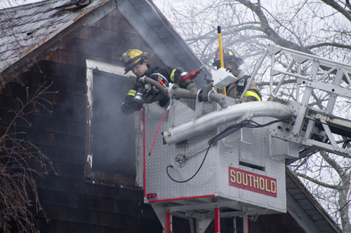 Members of four different fire departments responded to a fire in Southold on Tuesday. (Credit: Paul Squire)