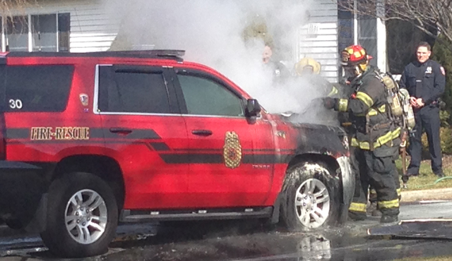 Cutchogue firefighters responded to the scene Saturday where their chiefs' vehicle caught fire. (Credit: Joe Werkmeister)