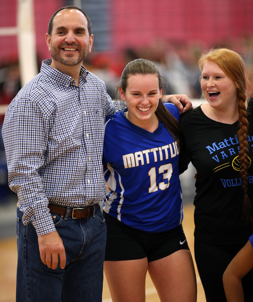 Setter and co-captain Carly Doorhy (13) and coach Frank Massa were all smiles after the win.
