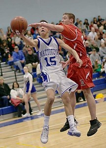 GARRET MEADE PHOTO  |  Mattituck senior Mike Mangiamele drives to the basket in the Tuckers' loss to Center Moriches Wednesday night.
