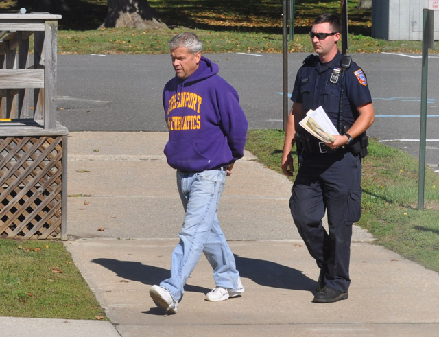 Gordon Haas is led into Southold Town Justice Court Sunday morning. (Credit: Grant Parpan)
