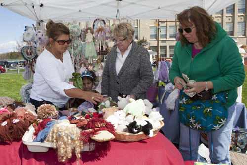 From left, Kirsten Droskoski, Keira Klotzer, 5, and Sharon Klotzer of Greenport shopping at Louise Eberle's stall at the Greenport PTA's Mother's Day craft fair Sunday. (Credit: Katharine Schroeder photos)