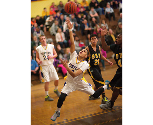 GARRET MEADE PHOTO | An off-balance Angel Colon putting up a shot for Greenport during its county semifinal victory over Bridgehampton on Wednesday night.