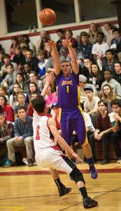 GARRET MEADE PHOTO | Timmy Stevens of Greenport, firing a shot over Pierson's Ian Barrett, led the Porters with 17 points.