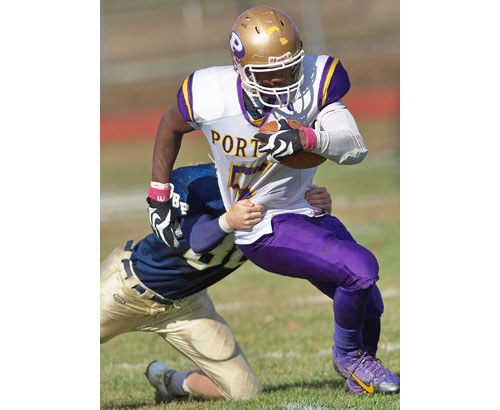 Gene Allen, shown in a game against Bayport-Blue Point last season, proved to be tough to tackle. The Greenport/Southold/Mattituck senior has made Hartwick College his college choice. (Credit: Garret Meade file)
