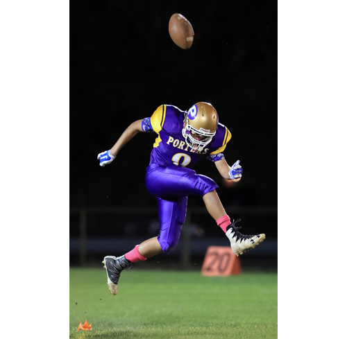 Greenport place kicker Tashan Lawrence #8 executes a perfect on side kick to start the first quarter against Wyandanch at Greenport High School in Greenport on September 7th, 2016