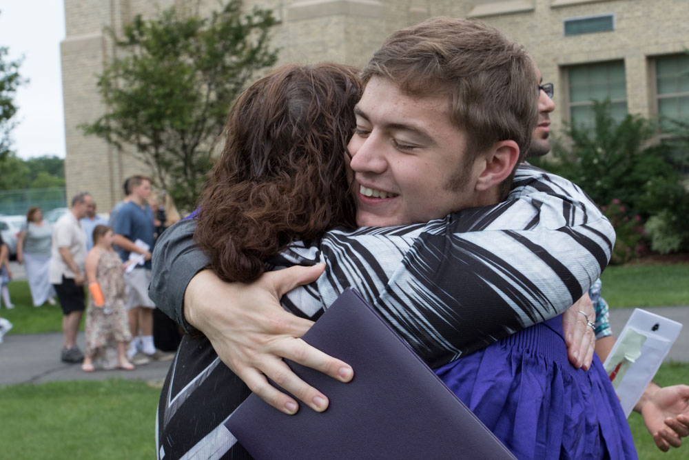A hug for the new graduate.