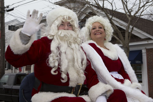 KATHARINE SCHROEDER PHOTO | Santa and Mrs. Claus arrive in Greenport Sunday.