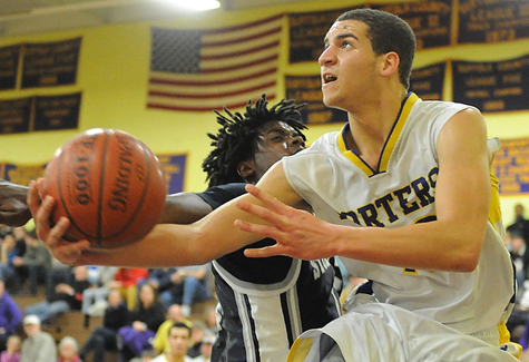 The 6-foot-5 Tremayne Hansen and the Greenport boys basketball play at noon Tuesady in the county championship game.